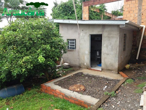 Área de serviço e espaço de terreno