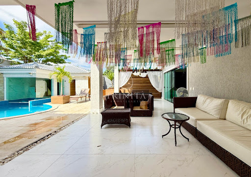 Lounge externo da casa à venda no condomínio Quintas do Rio
