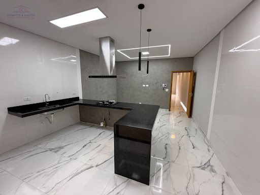 Ilha com cooktop e coifa