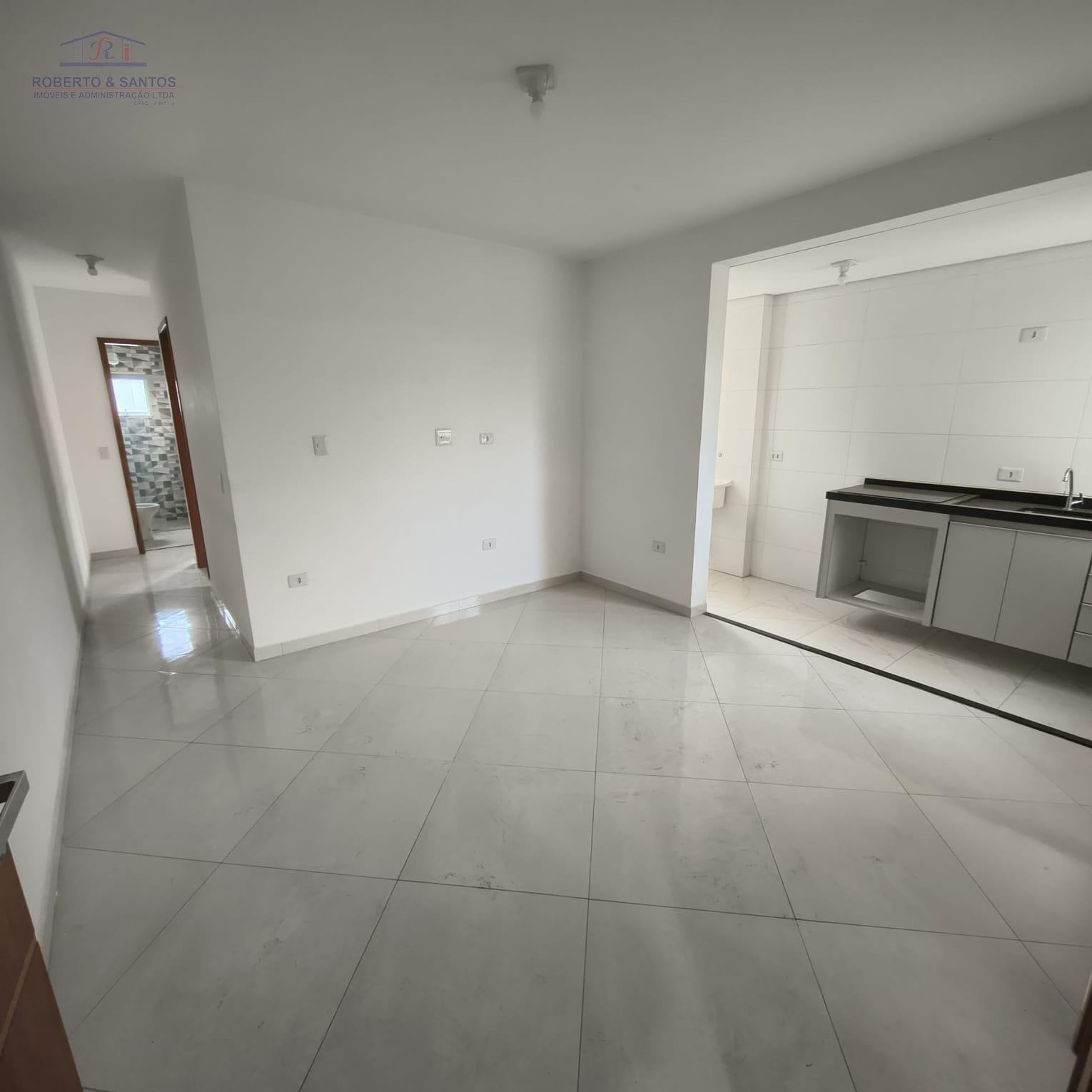 vista outro ângulo sala com cozinha 