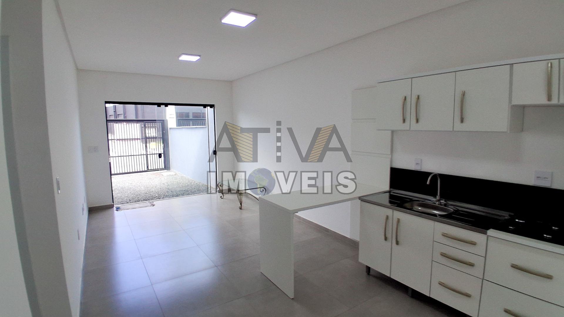 Sala estar social e cozinha